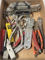 Variety of wrenches, pliers. Snips, utility