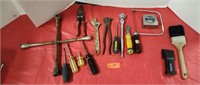 Assorted tools. Paint brush, wrenches, plyers a