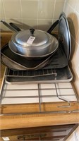 Various baking pans, wire rack, cutting board,