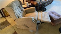 Beige lever handle recliner with two pillows and
