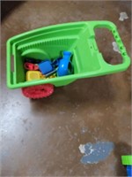 Toy wheel barrel with tools etc