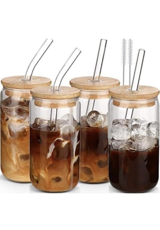 Glass cups with lids and straws