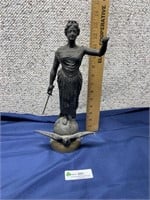 Lady with Sword on Globe Statue