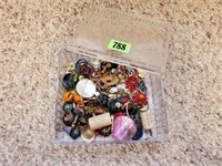 Trinket box of costume jewelry, earrings