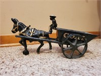 Cast iron mule driven coal wagon, miner