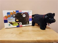 Battery operated Roly Poly toy black cow