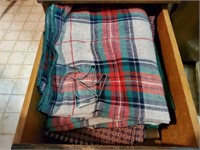 Drawer of tablecloths, table clips