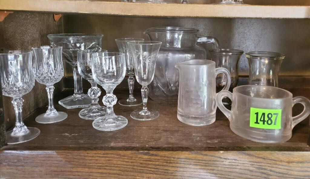 Shelf of glassware, sherry goblets, juice