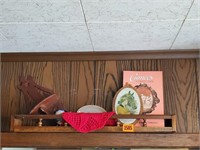 Wooden shelf, advertising pieces, doilie