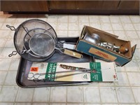 Sheet pan, metal skewers, strainers, cast iron