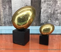 Brass egg sculptures