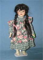Porcelain doll with pig tails