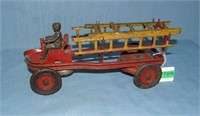 Early all tin fire ladder truck with ringing bell