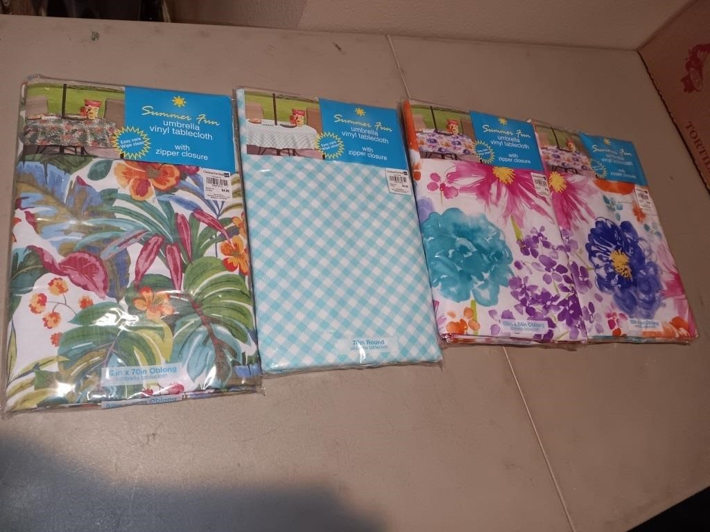 4 new in the package tablecloths.