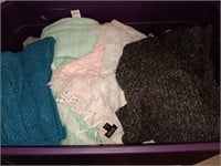 Bin of women's sweaters and more