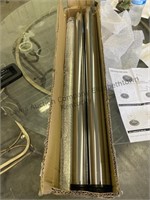 Appears to be four chrome table legs with