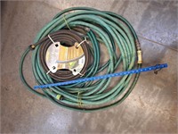New 50ft soaker hose and 2 garden hoses unknown