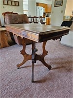 Antique table with carving 29"X30" on casters