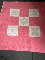 Pink and white quilted coverlet