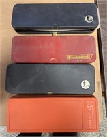 4 Partial gun cleaning kits in cases / Some empty