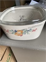 Three pieces of corningware, two have glass lids