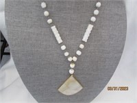White Stone Neclace With Sun Dial Pendent 30"