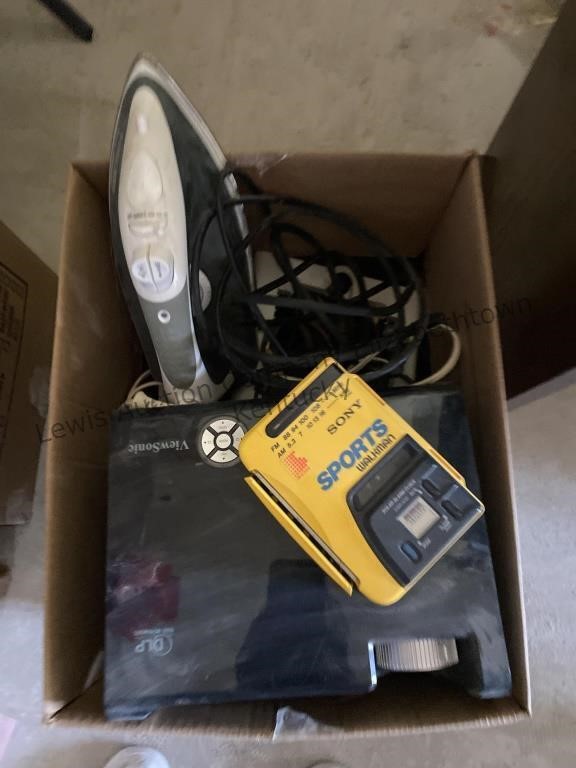 Box of electrical cords, a Walkman, iron and more