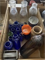 Two boxes of bottles and blue Ball jars