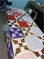 Vintage quilt displayed on 6 foot folding table,