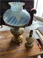 Call brave lamp with a blue swirl glass shade and