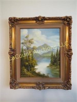 ornately framed painting water mountain scene