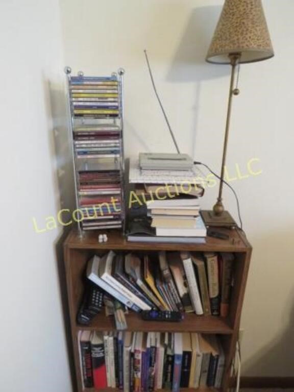 shelving unit w misc books lamp cds weather