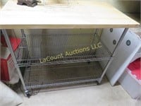 wire shelving unit w table top on wheels