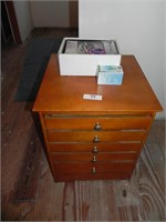 Small Wood Table with Drawers and Stuff on Top