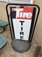 Mr Tire spinning curb advertising sign