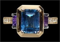 14K Yellow and white gold emerald cut blue topaz