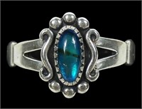 Sterling silver dentil set blue paua ring, size 8
