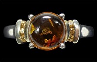 Sterling silver claw set amber ring with channel