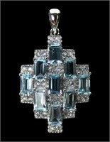 Sterling silver emerald cut blue topaz 9-stone