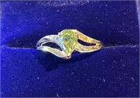 Ladies10k gold pear shaped peridot & diamond ring.