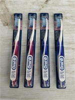 Oral-B 4 packs of toothbrushes pink and purple