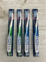Oral-B 4 packs of toothbrushes blue and green