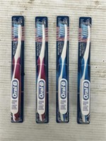 Oral-B 4 packs of toothbrushes blue and pink
