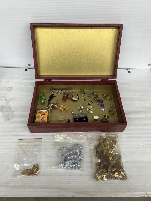 Bin of women’s pins and brooches