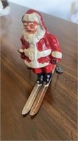 Vintage Cast Santa Claus on skis 4 inch tall