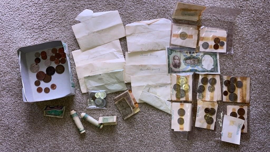 Large amount of foreign coins & paper money,