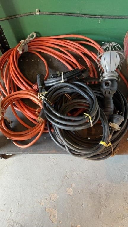 Two extension cords, one long two small cords one