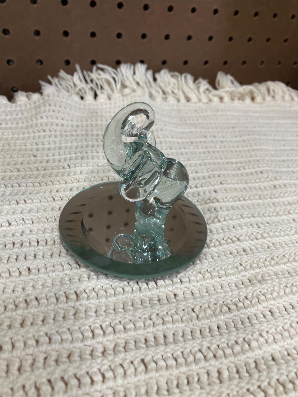 Small glass elephant, and  mirror