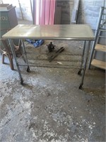 Rolling stainless steel table  49 1/2 inches x 2