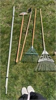 Two leaf rakes one edger one cloths props